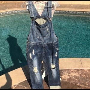 Machine distressed overalls